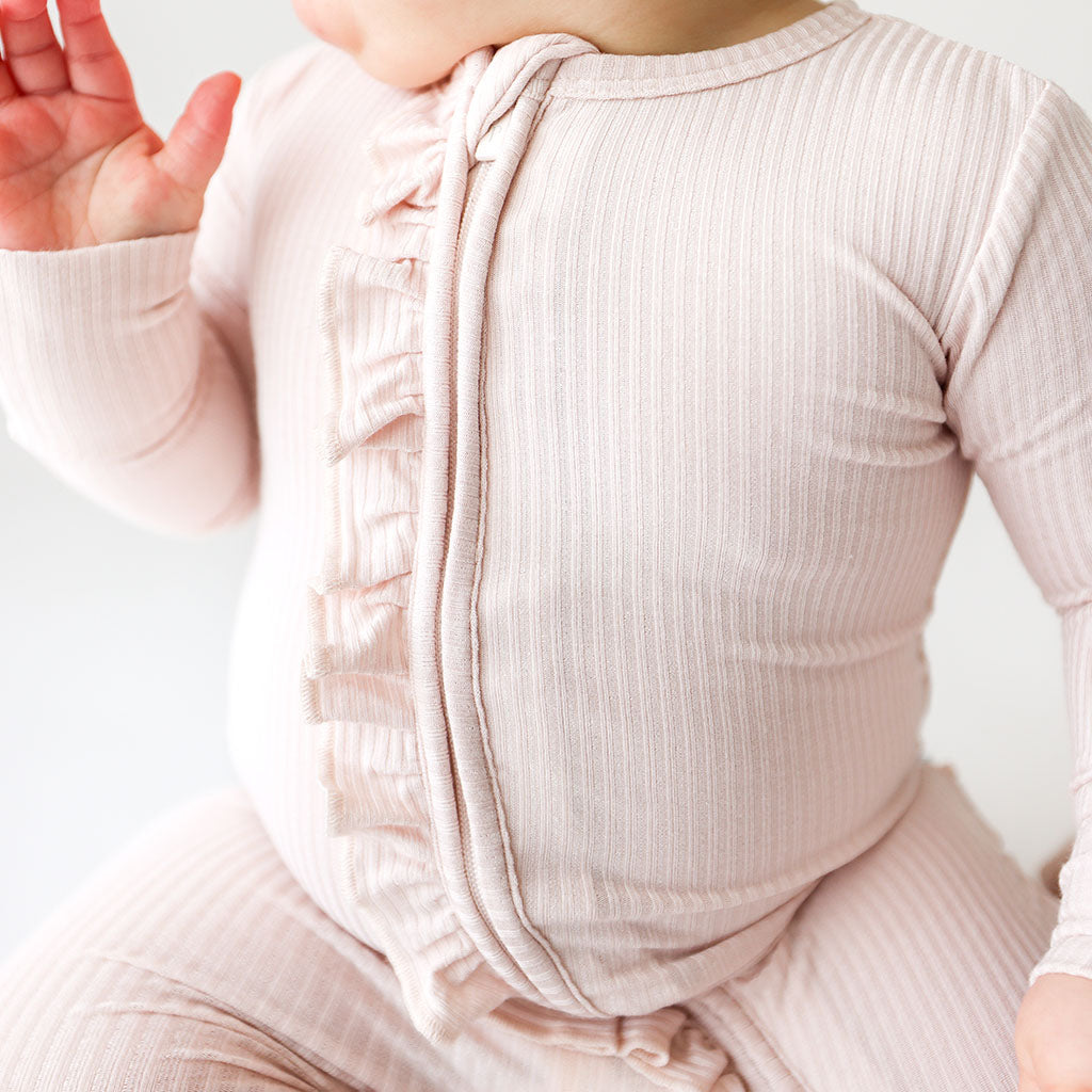 Sandy Blush Ribbed Footie Ruffled Zippered One Piece